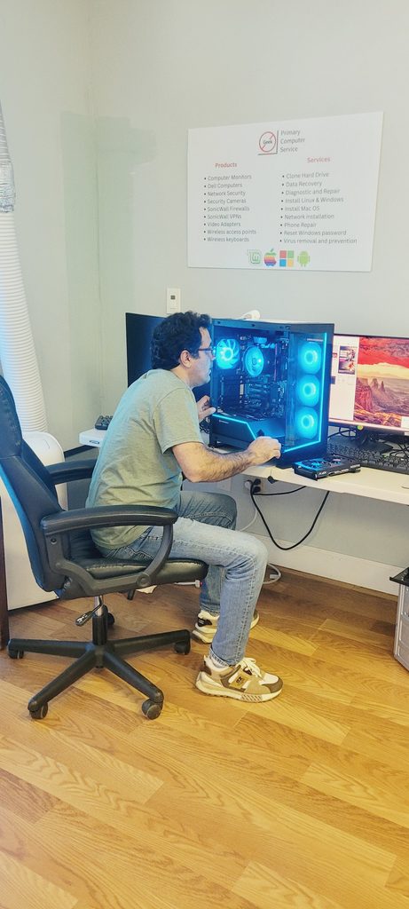 Technician tuning a gaming computer as part of professional computer repair and IT support services in Houston.